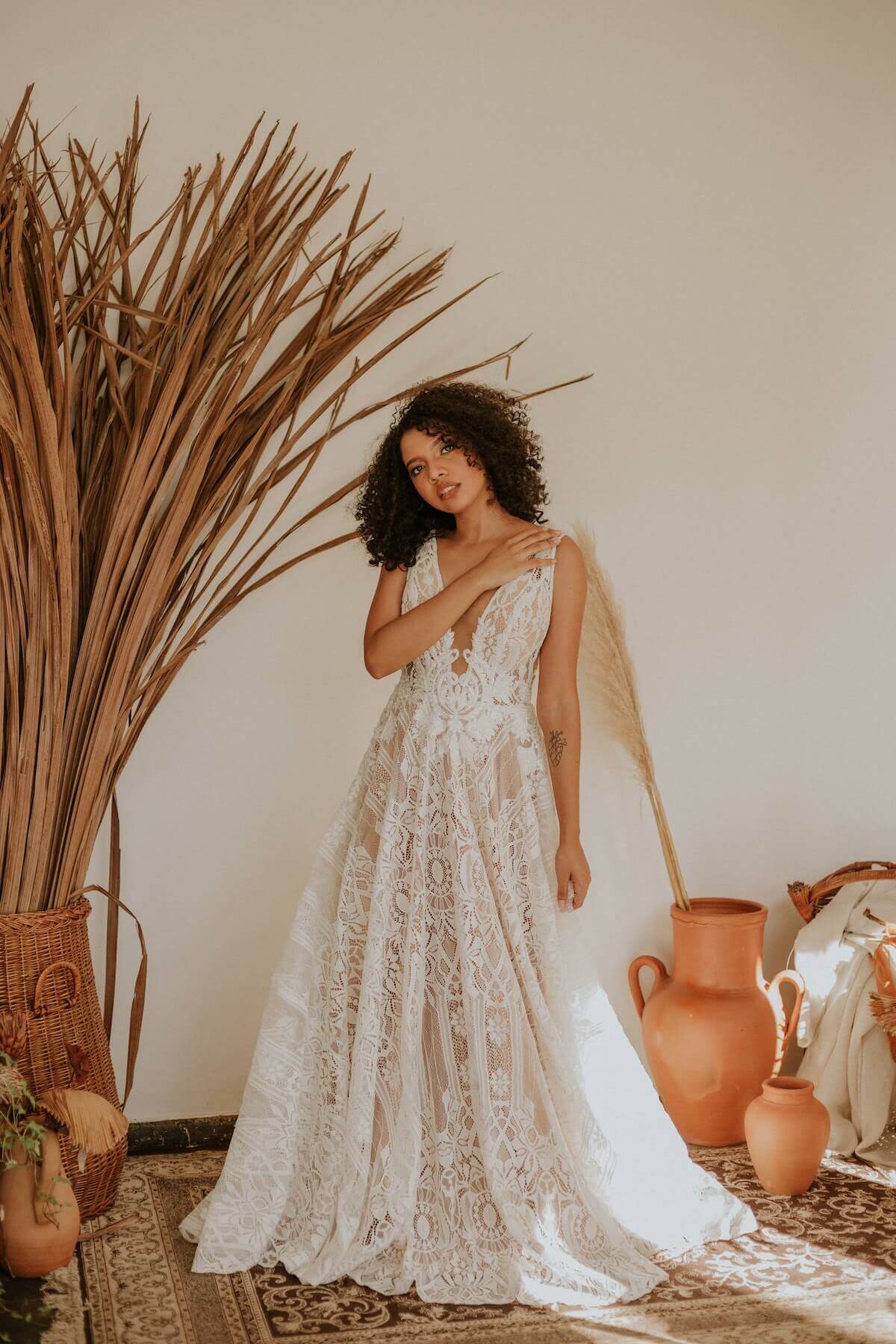 Woman standing in white dress.